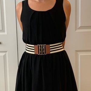 Black sleeveless belted dress